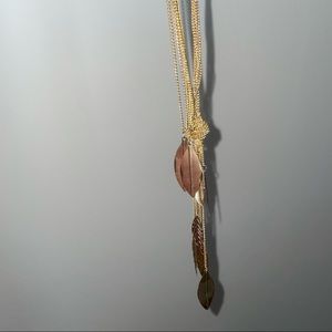 gold layer tied necklace with bronze leaf charms
